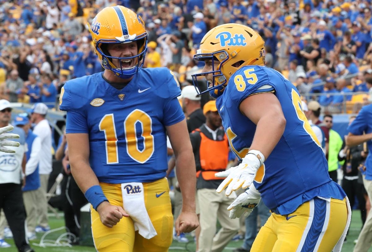 Sep 6, 2025; Pittsburgh, Pennsylvania, USA;  Pittsburgh Panthers quarterback Eli Holstein (10) and tight end Josh Altsman (85) celebrate after combining for a touchdown  against the Central Michigan Chippewas during the second quarter at Acrisure Stadium. Mandatory Credit: Charles LeClaire-Imagn Images