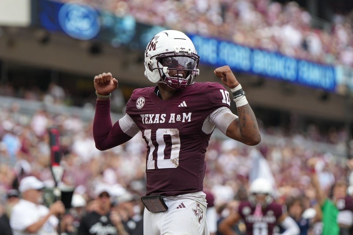 Sep 6, 2025; College Station, Texas, USA; Texas A&M Aggies quarterback Marcel Reed (10) celebrates after a touchdown pass during the second quarter against the Utah State Aggies at Kyle Field. Mandatory Credit: Sean Thomas-Imagn Images