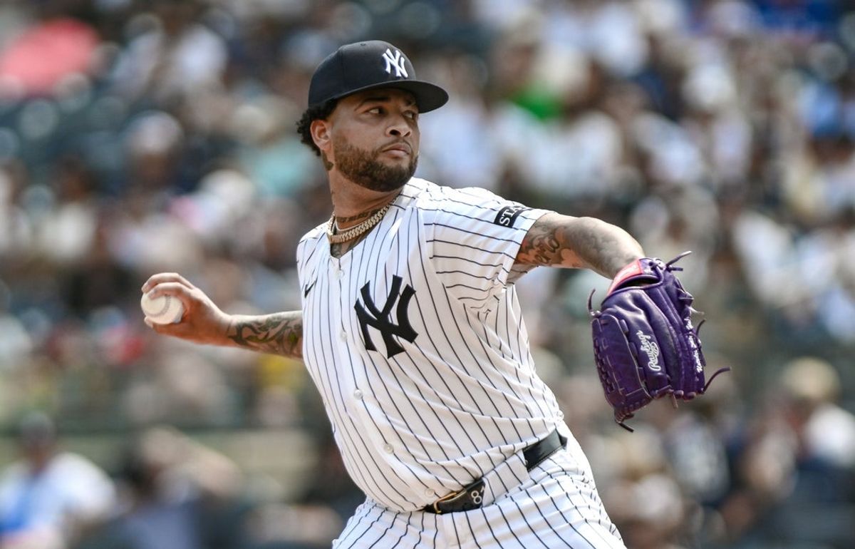 Sep 6, 2025; Bronx, New York, USA; New York Yankees pitcher Luis Gil (81) pitches against the Toronto Blue Jays during the first inning at Yankee Stadium. Mandatory Credit: John Jones-Imagn Images