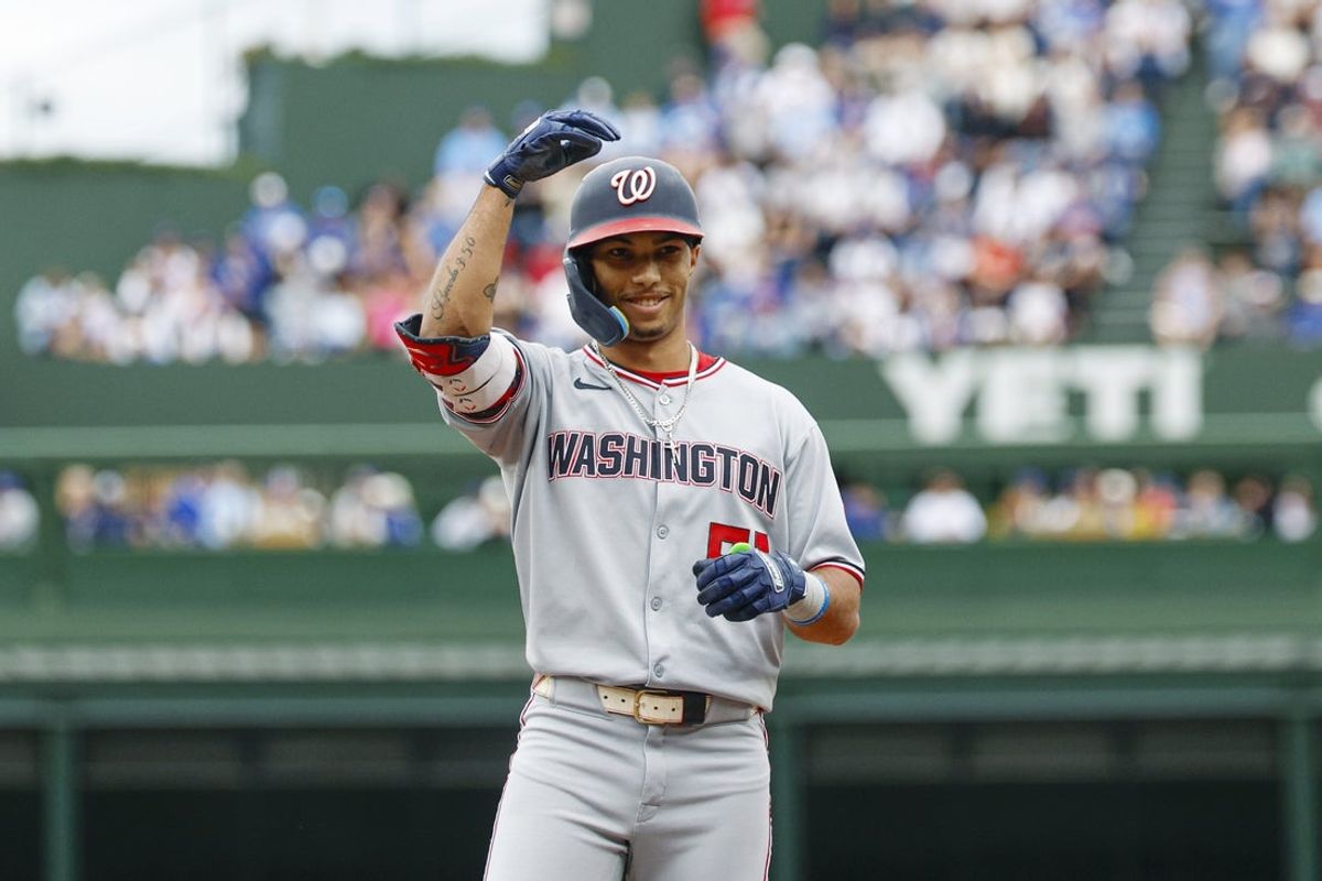 Sep 6, 2025; Chicago, Illinois, USA; Washington Nationals left fielder Daylen Lile (51) celebrates after hitting a single against the Chicago Cubs during the first inning at Wrigley Field. Mandatory Credit: Kamil Krzaczynski-Imagn Images