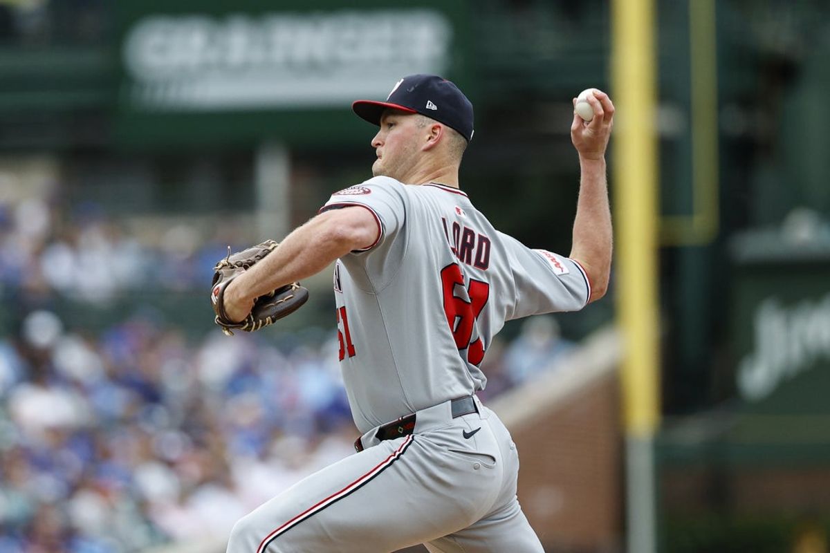 Sep 6, 2025; Chicago, Illinois, USA; Washington Nationals starting pitcher Brad Lord (61) delivers a pitch against the Washington Nationals during the first inning at Wrigley Field. Mandatory Credit: Kamil Krzaczynski-Imagn Images