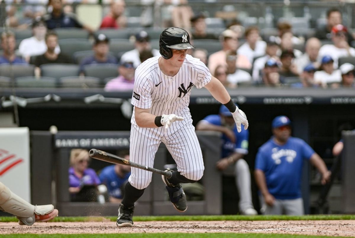 Sep 6, 2025; Bronx, New York, USA; New York Yankees first baseman Ben Rice (22) hits a single against the Toronto Blue Jays during the fifth inning at Yankee Stadium. Mandatory Credit: John Jones-Imagn Images