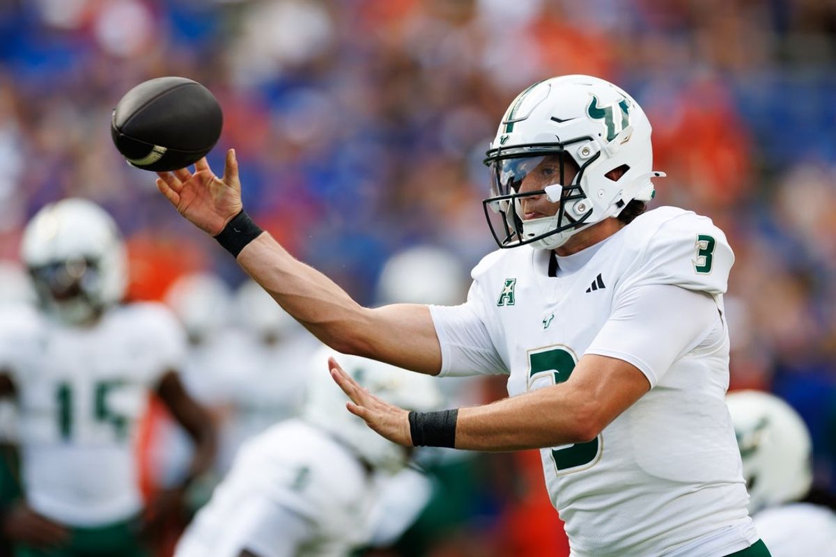 Sep 6, 2025; Gainesville, Florida, USA; South Florida Bulls quarterback Gaston Moore (3) throws the ball before the game against the Florida Gators at Ben Hill Griffin Stadium. Mandatory Credit: Matt Pendleton-Imagn Images