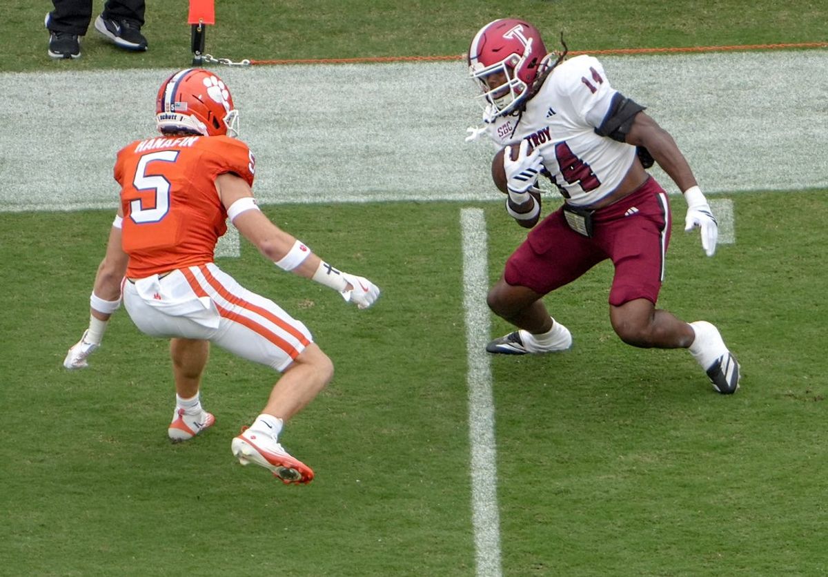 Clemson defensive back Ronan Hanafin (5) gets ready to tackle Troy Trojans tight end Ethan Conner (14) during the first quarter at Memorial Stadium in Clemson, S.C. Saturday, September 6, 2025.