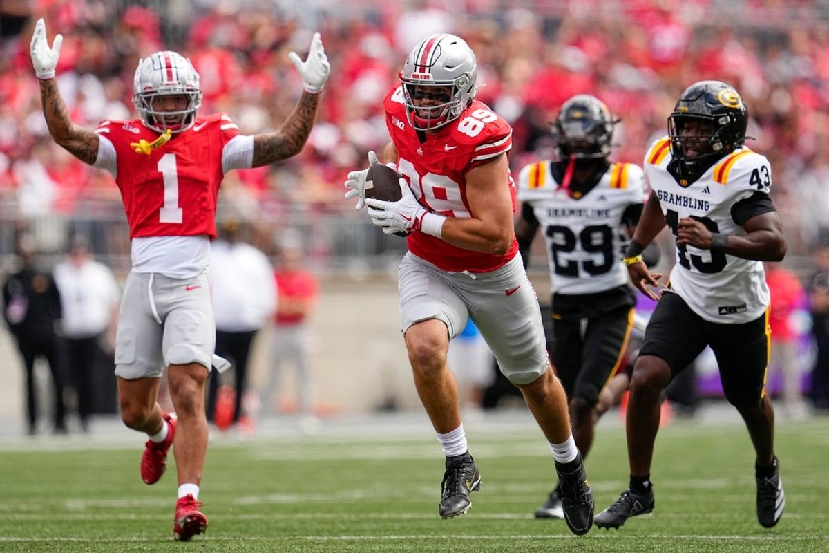 Ohio State Buckeyes tight end Will Kacmarek (89) catches a touchdown pass in front of Grambling State Tigers linebacker Marcellius Johnson (43) during the first half of the NCAA football game at Ohio Stadium on Sept. 6, 2025.