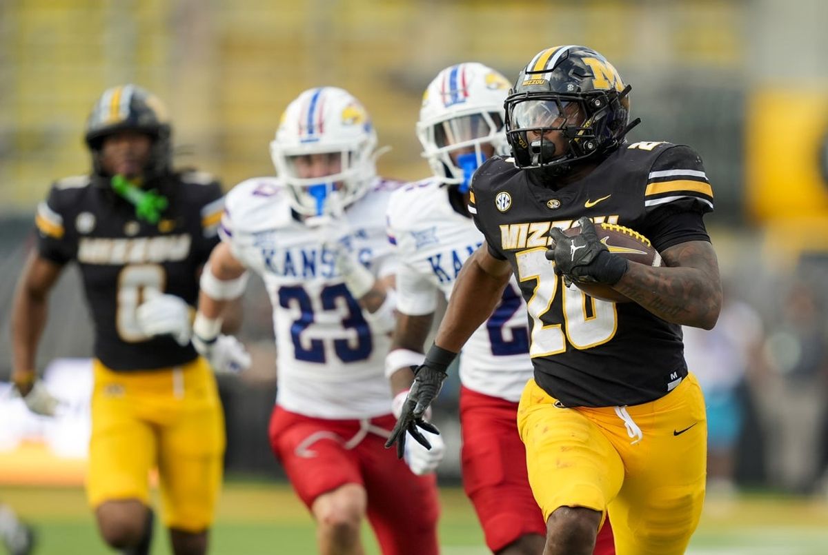 Sep 6, 2025; Columbia, Missouri, USA; Missouri Tigers running back Jamal Roberts (20) runs for a touchdown during the fourth quarter against the Kansas Jayhawks at Faurot Field at Memorial Stadium. Mandatory Credit: Jay Biggerstaff-Imagn Images
