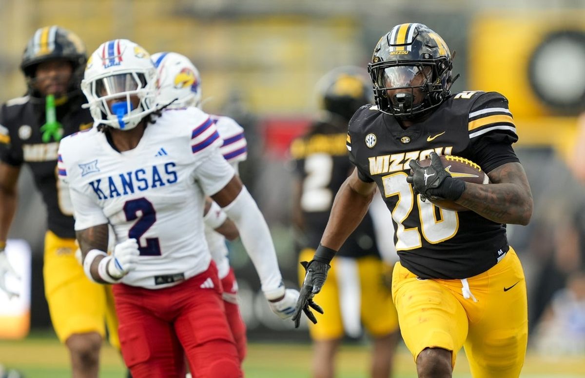 Sep 6, 2025; Columbia, Missouri, USA; Missouri Tigers running back Jamal Roberts (20) runs for a touchdown during the fourth quarter against the Kansas Jayhawks at Faurot Field at Memorial Stadium. Mandatory Credit: Jay Biggerstaff-Imagn Images