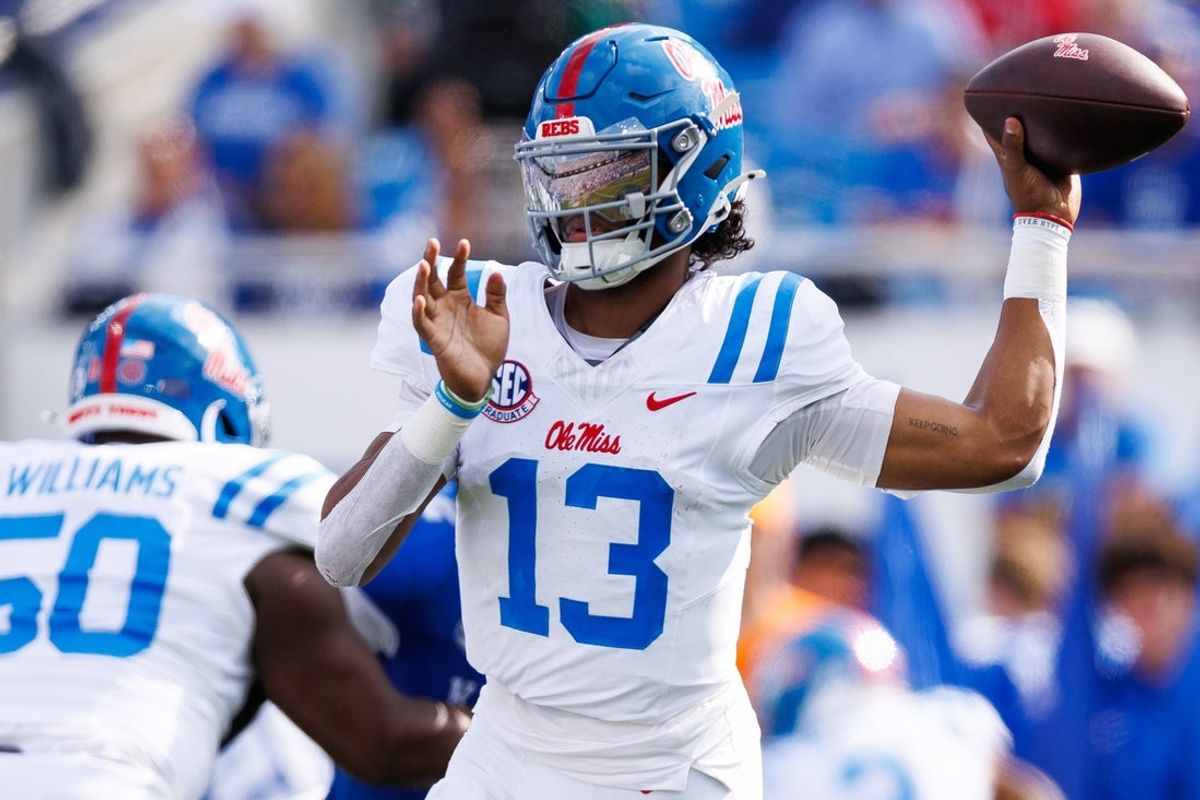 Sep 6, 2025; Lexington, Kentucky, USA; Mississippi Rebels quarterback Austin Simmons (13) throws a pass during the second quarter against the Kentucky Wildcats at Kroger Field. Mandatory Credit: Jordan Prather-Imagn Images