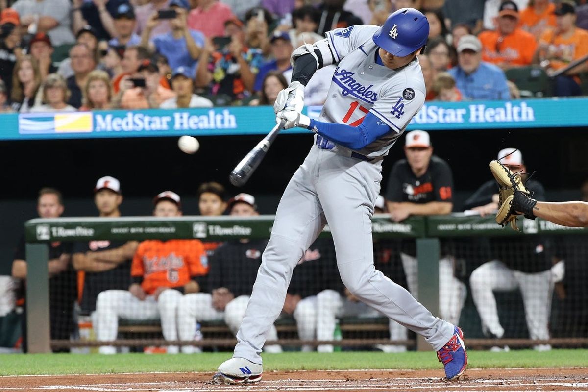 Sep 6, 2025; Baltimore, Maryland, USA; Los Angeles Dodgers two-way player Shohei Ohtani (17) hits a single during the first inning against the Baltimore Orioles at Oriole Park at Camden Yards. Mandatory Credit: Daniel Kucin Jr.-Imagn Images