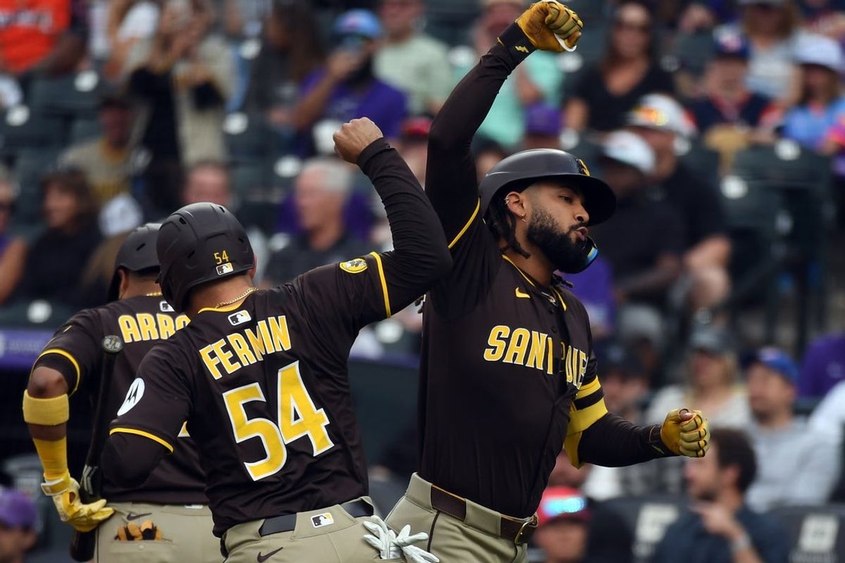 Sep 6, 2025; Denver, Colorado, USA; San Diego Padres outfielder Fernando Tatis Jr. (23) and catcher Freddy Fermin (54) celebrate after a three-run home run during the second inning against the Colorado Rockies at Coors Field. Mandatory Credit: Christopher Hanewinckel-Imagn Images