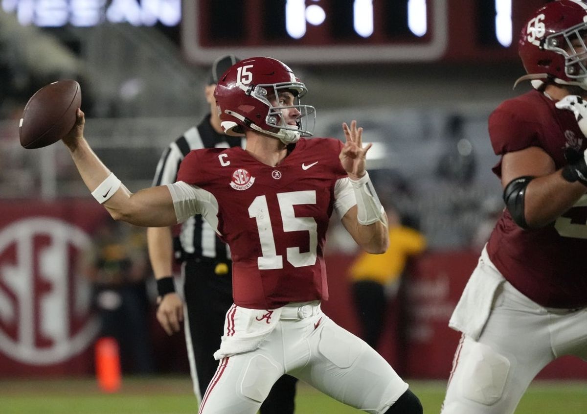 Sep 6, 2025; Tuscaloosa, Alabama, USA;  Alabama quarterback Ty Simpson (15) throws against UL Monroe behind a block by Alabama offensive lineman Geno VanDeMark (56) at Saban Field at Bryant-Denny Stadium. Mandatory Credit: Gary Cosby Jr.-Imagn Images