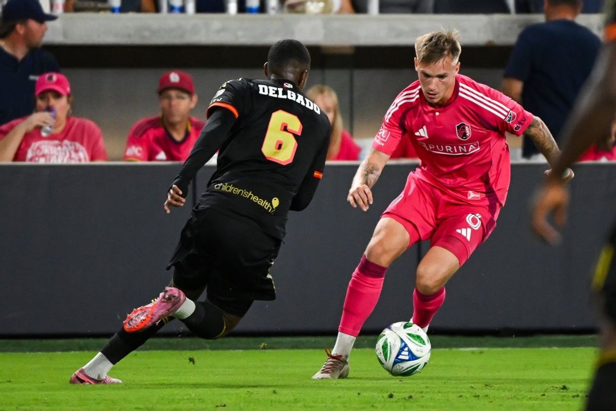 Sep 6, 2025; St. Louis, Missouri, USA; St. Louis City midfielder Conrad Wallem (6) controls the ball against FC Dallas midfielder Patrickson Delgado (6) in the second half at Energizer Park. Mandatory Credit: Connor Hamilton-Imagn Images