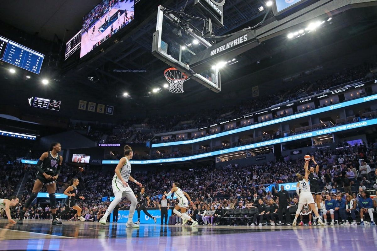 Sep 6, 2025; San Francisco, California, USA;  Golden State Valkyries forward Janelle Salaun (13) shoots over Minnesota Lynx guard Kayla McBride (21) in front of a sold out crowd in the fourth quarter at Chase Center. Mandatory Credit: David Gonzales-Imagn Images