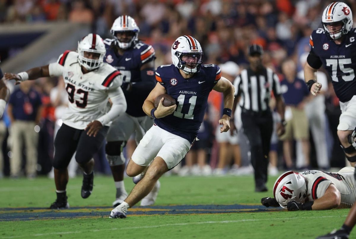 Sep 6, 2025; Auburn, Alabama, USA;  Auburn Tigers quarterback Jackson Arnold (11) scrambles during the second quarter against the Ball State Cardinals at Jordan-Hare Stadium. Mandatory Credit: John Reed-Imagn Images