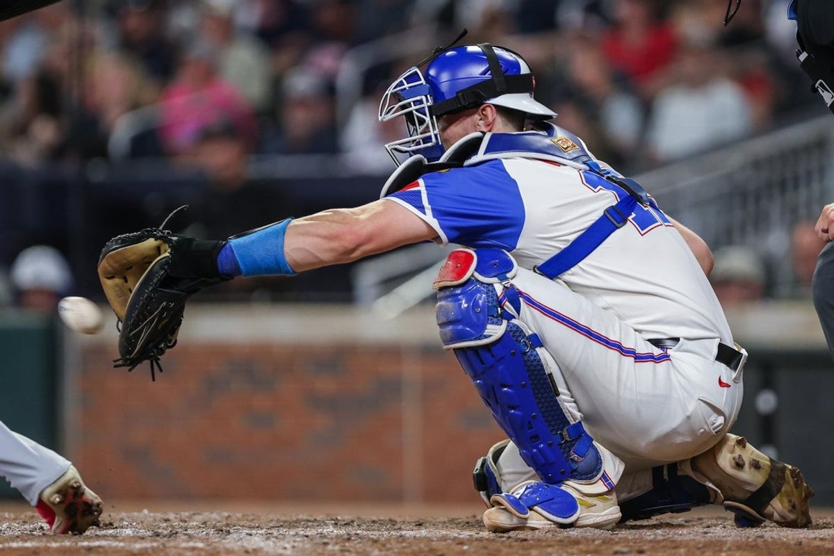 Sep 6, 2025; Cumberland, Georgia, USA; Atlanta Braves catcher Sean Murphy (12) makes a catch during the game against the Seattle Mariners during the seventh inning at Truist Park. Mandatory Credit: Jordan Godfree-Imagn Images