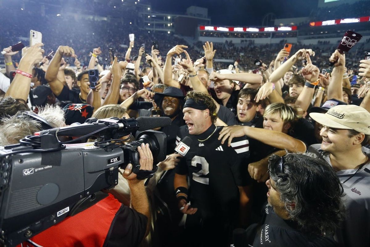 Sep 6, 2025; Starkville, Mississippi, USA; Mississippi State Bulldogs fans crowd around quarterback Blake Shapen (2) after defeating the Arizona State Sun Devilsat Davis Wade Stadium at Scott Field. Mandatory Credit: Petre Thomas-Imagn Images