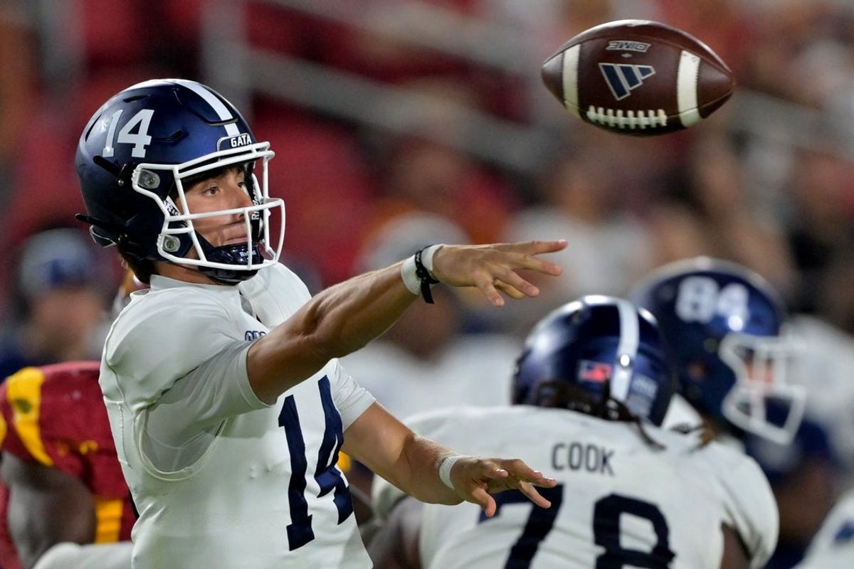 Sep 6, 2025; Los Angeles, California, USA; Georgia Southern Eagles quarterback Turner Helton (14) throws a pass in the second half against the USC Trojans at United Airlines Field at the Los Angeles Memorial Coliseum. Mandatory Credit: Jayne Kamin-Oncea-Imagn Images