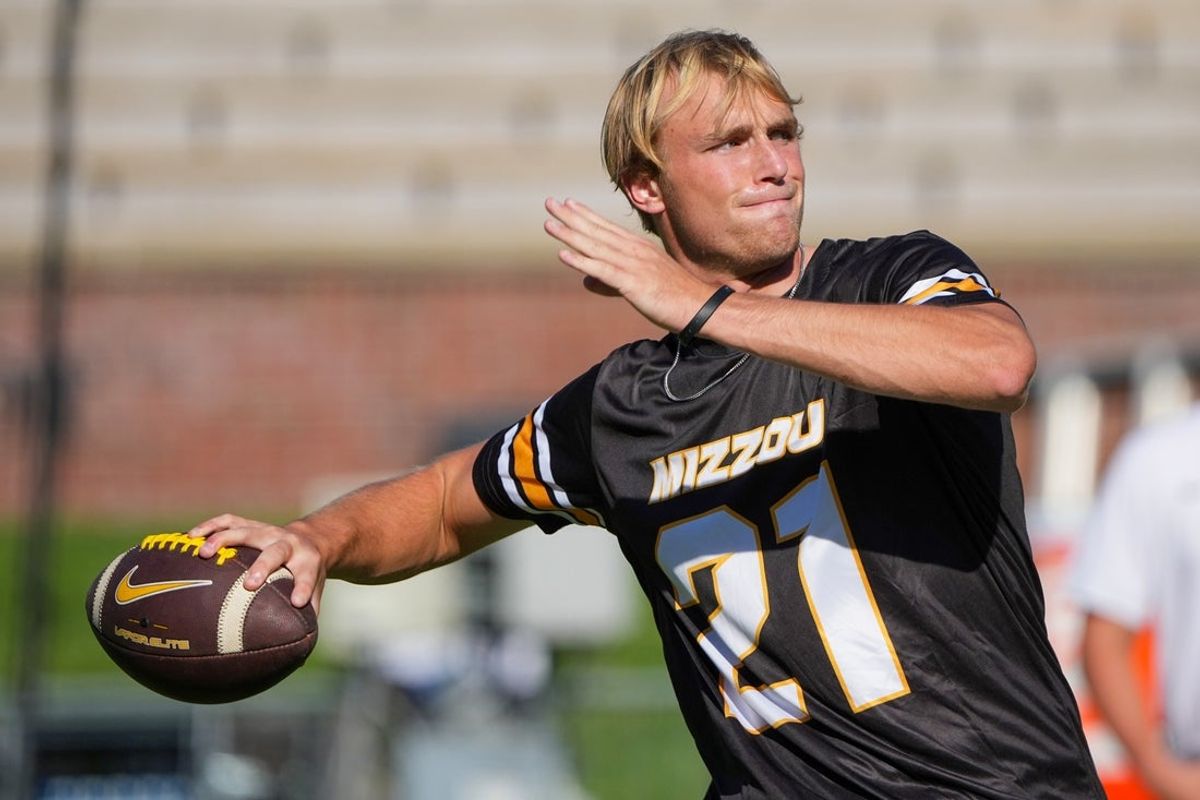 Aug 28, 2025; Columbia, Missouri, USA; Missouri Tigers quarterback Sam Horn (21) warms up against the Central Arkansas Bears prior to a game at Faurot Field at Memorial Stadium. Mandatory Credit: Denny Medley-Imagn Images