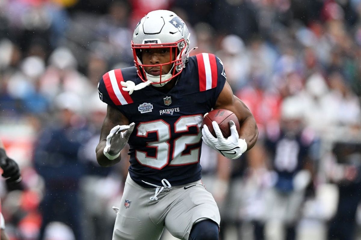 Sep 7, 2025; Foxborough, Massachusetts, USA; New England Patriots running back TreVeyon Henderson (32) rushes the ball against the Las Vegas Raiders in the first half at Gillette Stadium. Mandatory Credit: Brian Fluharty-Imagn Images