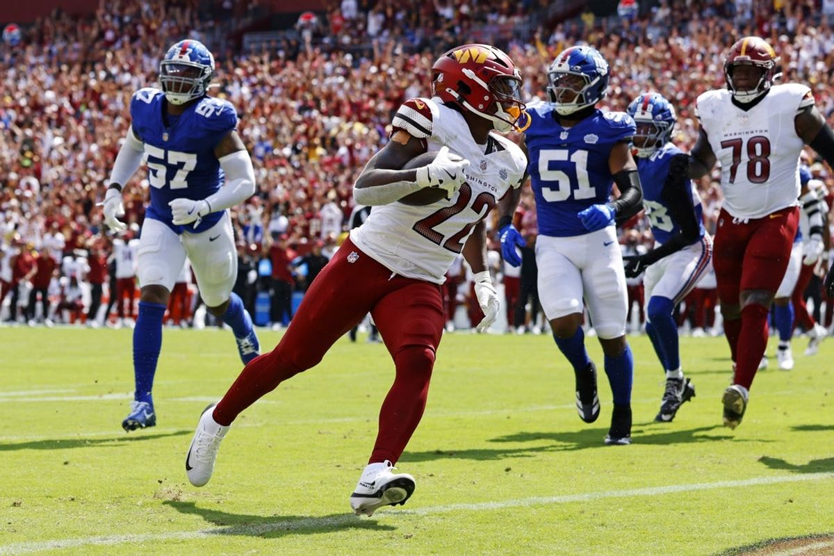Sep 7, 2025; Landover, Maryland, USA; Washington Commanders running back Jacory Croskey-Merritt (22) scores a touchdown during the second quarter against the New York Giants at Northwest Stadium. Mandatory Credit: Peter Casey-Imagn Images
