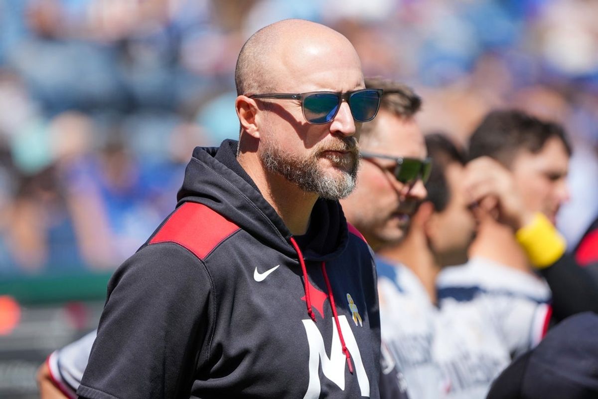 Minnesota Twins manager Rocco Baldelli (5) stands on field against the Kansas City Royals prior to a game at Kauffman Stadium.