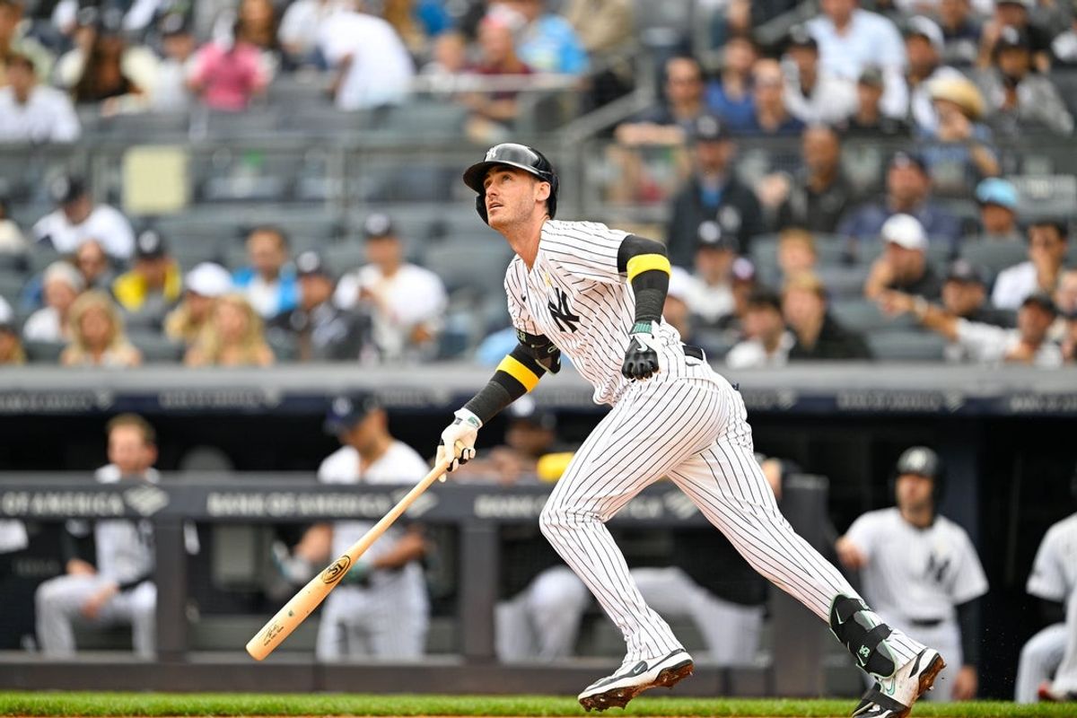 Sep 7, 2025; Bronx, New York, USA; New York Yankees left fielder Cody Bellinger (35) hits the ball during the first inning  against the Toronto Blue Jays at Yankee Stadium. Mandatory Credit: Mark Smith-Imagn Images