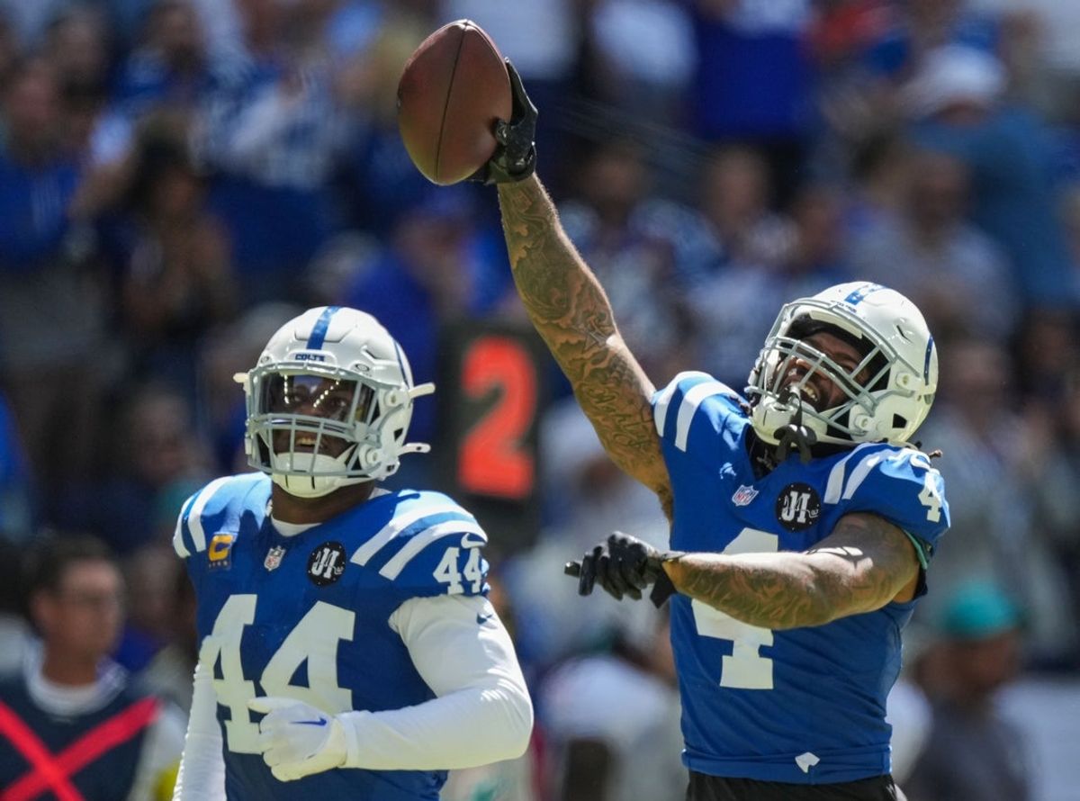 Sep 7, 2025; Indianapolis, Indiana, USA; Indianapolis Colts cornerback Xavien Howard (4) celebrates a fumble and a turnover in the game against the Miami Dolphins at Lucas Oil Stadium. Mandatory Credit: Grace Hollars-USA TODAY Network via Imagn Images