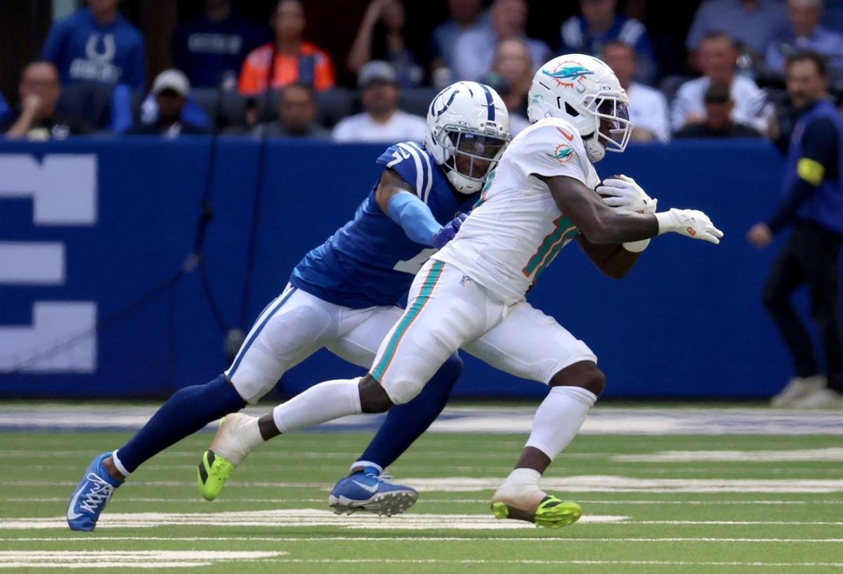 Sep 7, 2025; Indianapolis, Indiana, USA; Miami Dolphins wide receiver Tyreek Hill (10) runs against Indianapolis Colts cornerback Charvarius Ward (7) during the second half at Lucas Oil Stadium. Mandatory Credit: Trevor Ruszkowski-Imagn Images