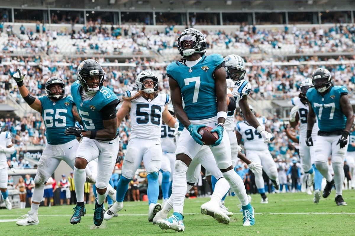 Sep 7, 2025; Jacksonville, Florida, USA; Jacksonville Jaguars wide receiver Brian Thomas Jr. (7) reacts after scoring on a 9-yard touchdown run against the Carolina Panthers during the first half at EverBank Stadium. Mandatory Credit: Nathan Ray Seebeck-Imagn Images