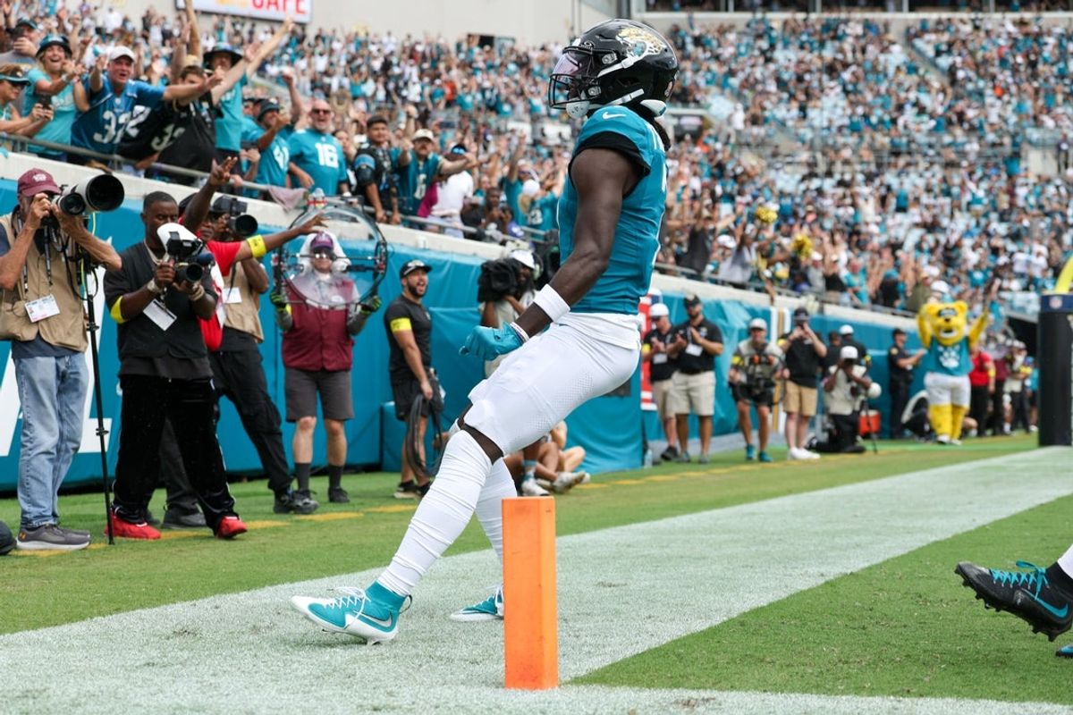 Sep 7, 2025; Jacksonville, Florida, USA; Jacksonville Jaguars wide receiver Brian Thomas Jr. (7) reacts after scoring on a 9-yard touchdown run against the Carolina Panthers during the first half at EverBank Stadium. Mandatory Credit: Nathan Ray Seebeck-Imagn Images