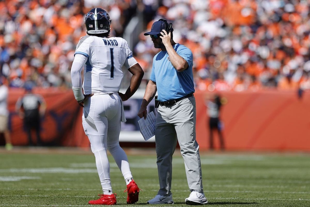Sep 7, 2025; Denver, Colorado, USA; Tennessee Titans head coach Brian Callahan talks to quarterback Cam Ward (1) in the first half at Empower Field at Mile High. Mandatory Credit: Isaiah J. Downing-Imagn Images
