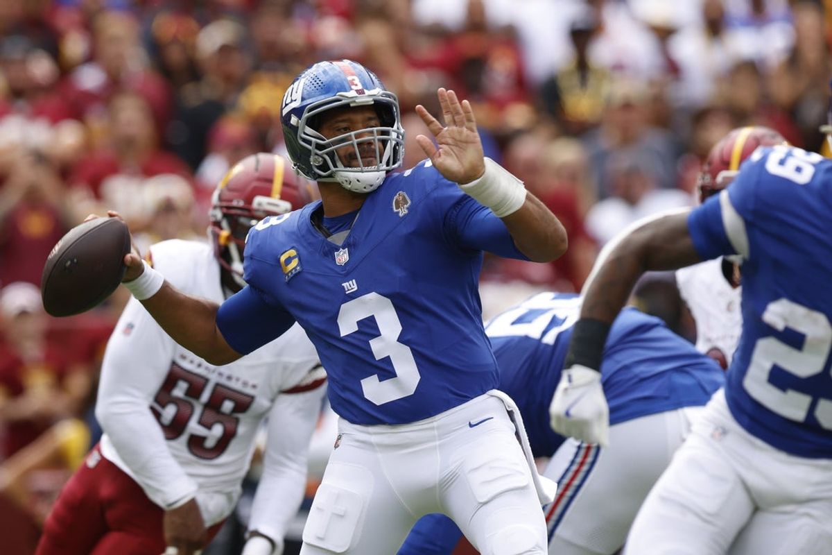 Sep 7, 2025; Landover, Maryland, USA; New York Giants quarterback Russell Wilson (3) makes a pass during the first quarter against the Washington Commanders at Northwest Stadium. Mandatory Credit: Peter Casey-Imagn Images