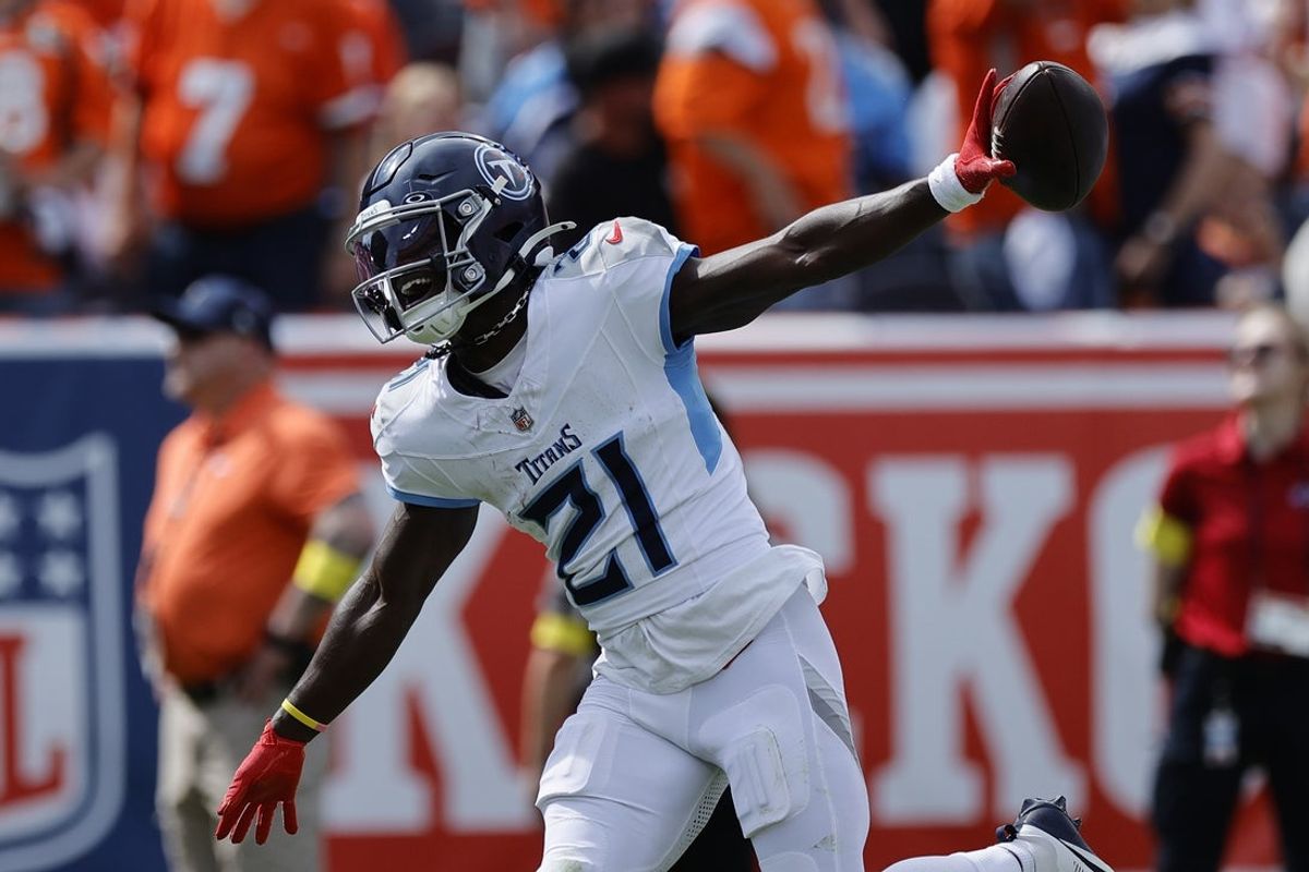 Sep 7, 2025; Denver, Colorado, USA; Tennessee Titans cornerback Roger McCreary (21) reacts after an interception against the Denver Broncos in the first half at Empower Field at Mile High. Mandatory Credit: Isaiah J. Downing-Imagn Images