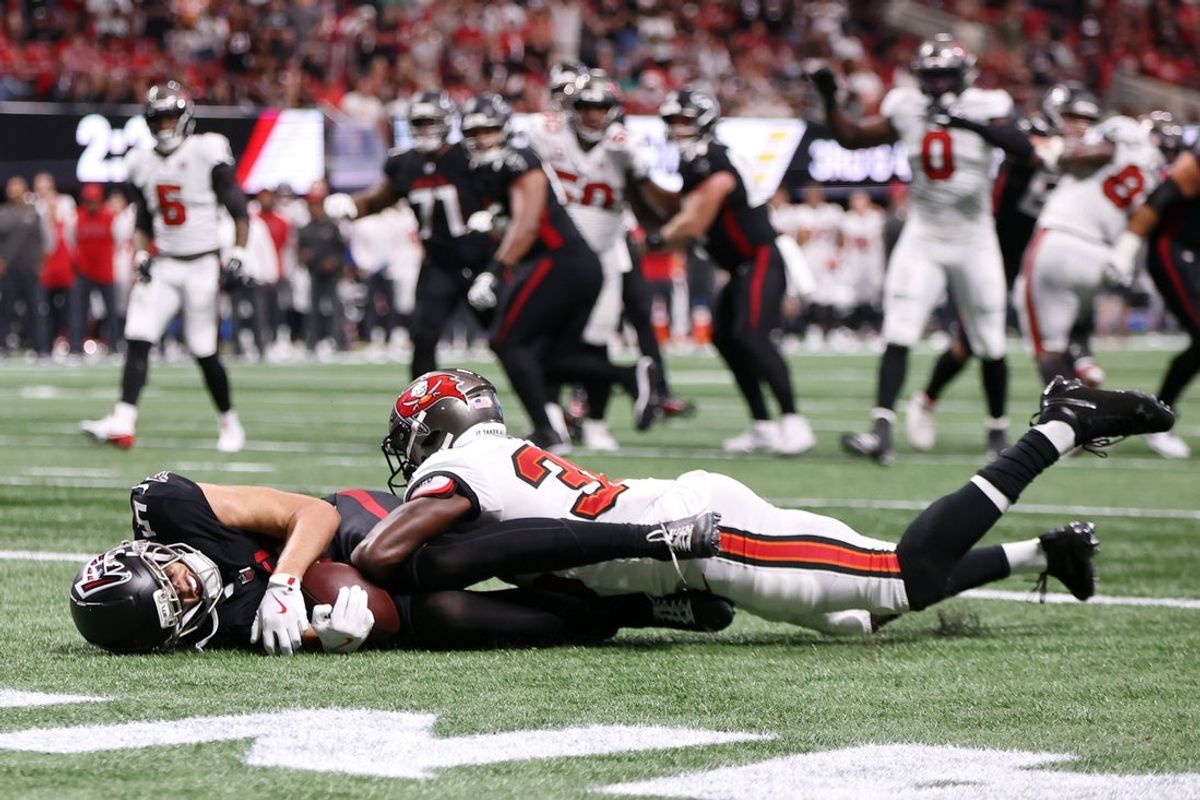 Sep 7, 2025; Atlanta, Georgia, USA; Atlanta Falcons wide receiver Drake London (5) attempts a catch against Tampa Bay Buccaneers cornerback Jamel Dean (35) during the fourth quarter at Mercedes-Benz Stadium. Mandatory Credit: Brett Davis-Imagn Images