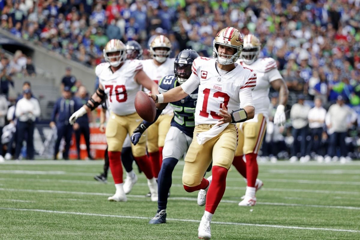 Sep 7, 2025; Seattle, Washington, USA; San Francisco 49ers quarterback Brock Purdy (13) runs the ball during the first half against San Francisco 49ers at Lumen Field. Mandatory Credit: Joe Nicholson-Imagn Images