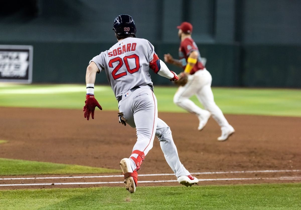 Sep 7, 2025; Phoenix, Arizona, USA; Boston Red Sox pinch hitter Nick Sogard hits a two run double in the ninth inning against the Arizona Diamondbacks at Chase Field. Mandatory Credit: Mark J. Rebilas-Imagn Images