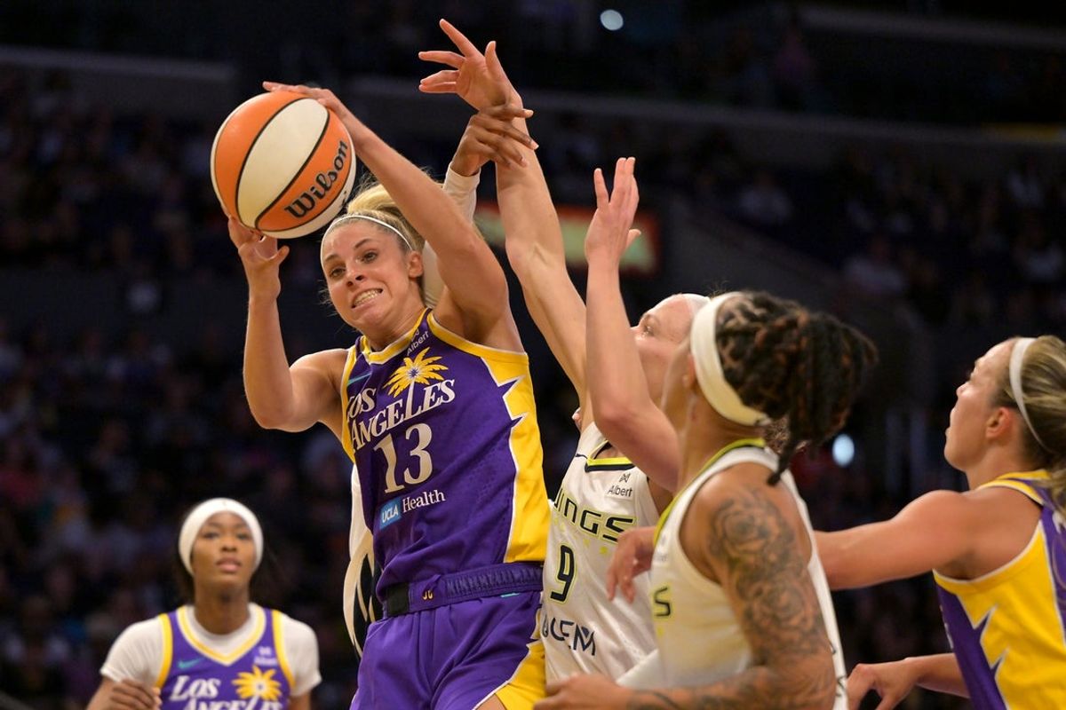 Sep 7, 2025; Los Angeles, California, USA;  Los Angeles Sparks guard Sarah Ashlee Barker (13) battles Dallas Wings guard Grace Berger (9) for a rebound during the first half at Crypto.com Arena. Mandatory Credit: Jayne Kamin-Oncea-Imagn Images