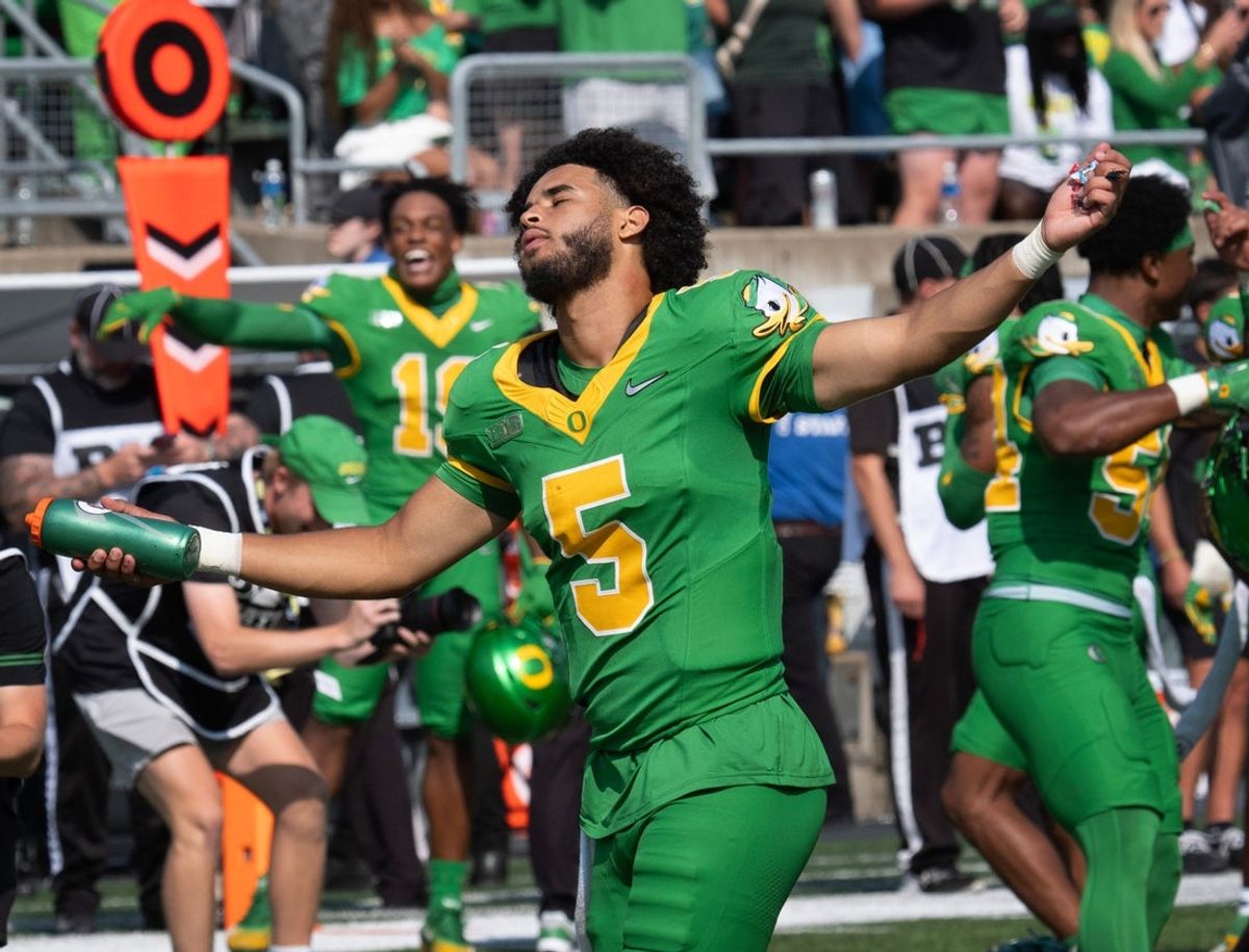 Oregon quarterback Dante Moore dances to the song “Shout” during a timeout at Autzen.