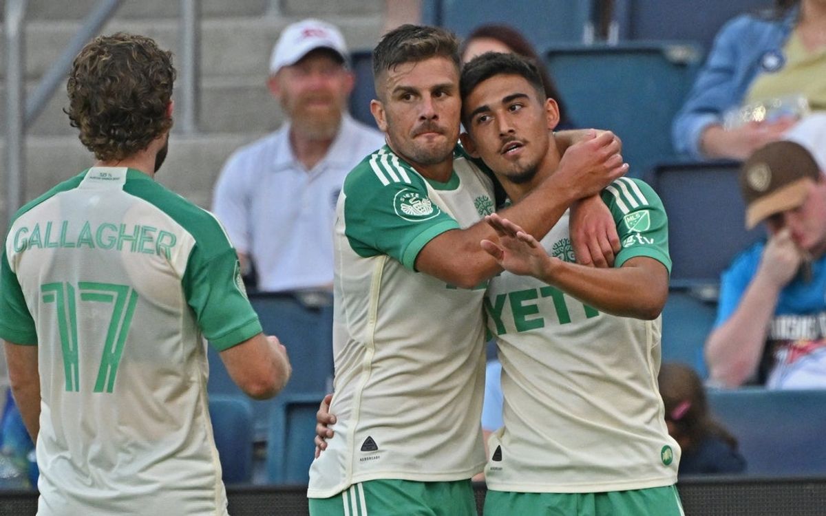 Sep 7, 2025; Kansas City, Kansas, USA;  Austin FC midfielder Owen Wolff (33) celebrates after scoring a goal with teammate forward Diego Rubio (21) in the first half against Sporting Kansas City at Children's Mercy Park. Mandatory Credit: Peter Aiken-Imagn Images