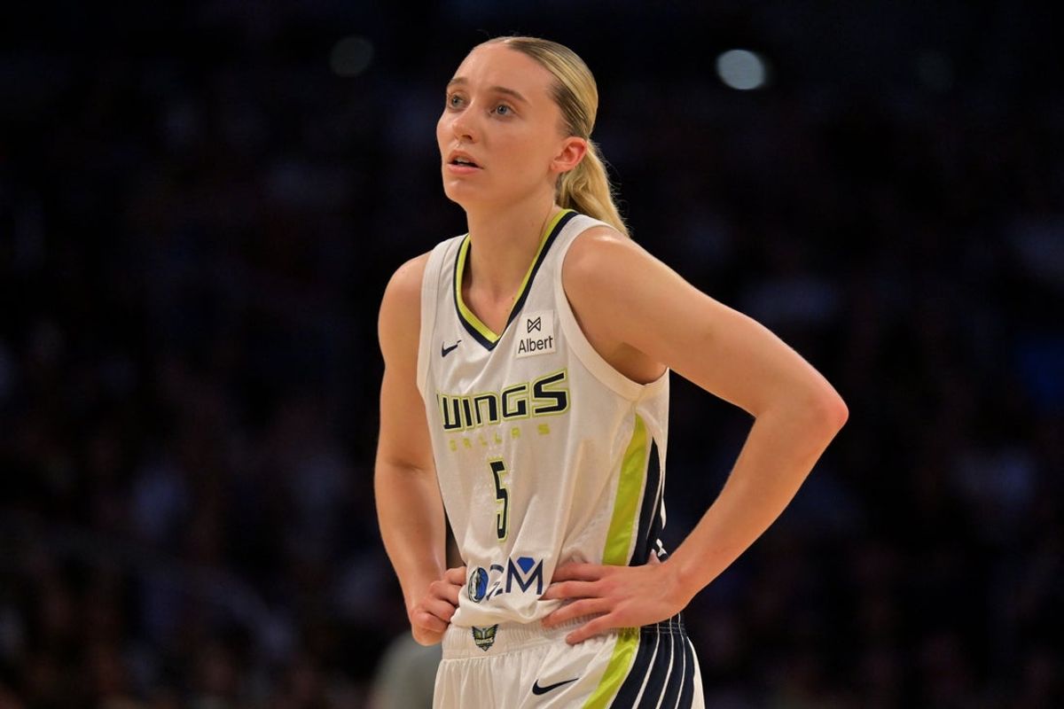 Sep 7, 2025; Los Angeles, California, USA;  Dallas Wings guard Paige Bueckers (5) looks on during the first half against the Los Angeles Sparks at Crypto.com Arena. Mandatory Credit: Jayne Kamin-Oncea-Imagn Images
