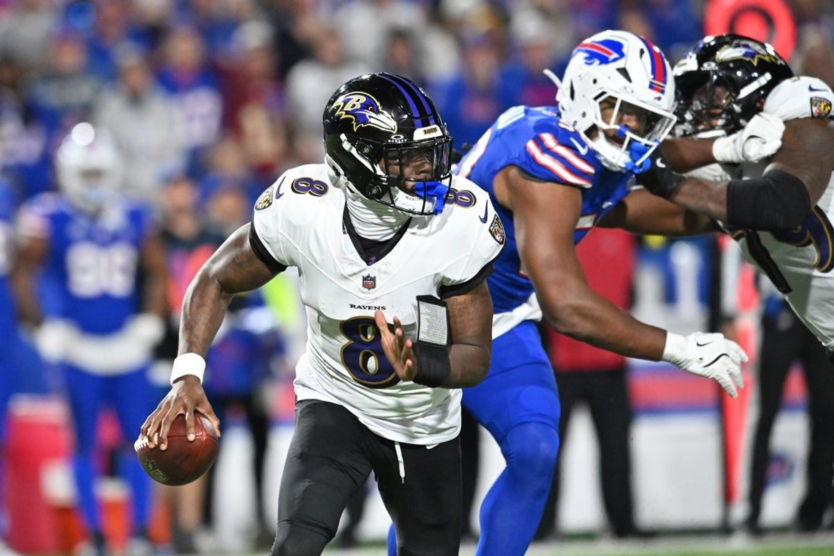 Sep 7, 2025; Orchard Park, New York, USA;  Baltimore Ravens quarterback Lamar Jackson (8) runs the ball during the fourth quarter against the Buffalo Bills at Highmark Stadium. Mandatory Credit: Mark Konezny-Imagn Images