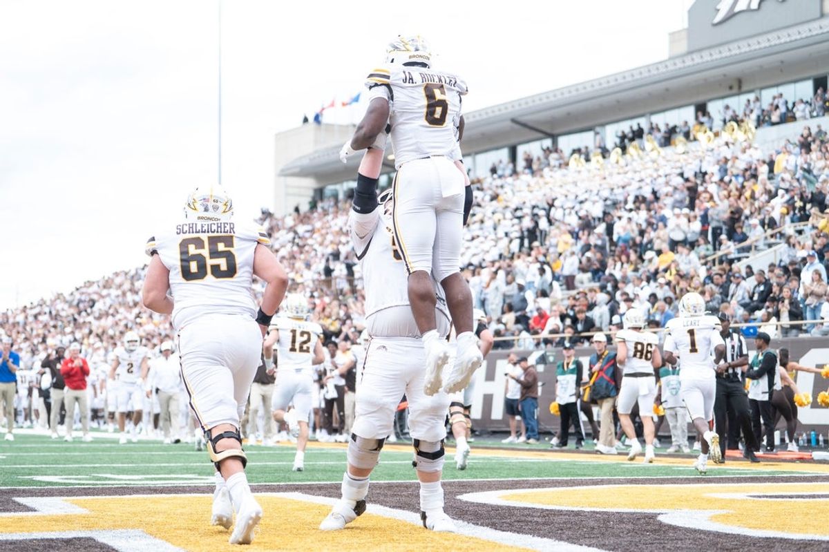 Western Michigan senior John Hofer and junior Jalen Buckley celebrate a touchdown during the home-opening game against North Texas at Western Michigan University on Saturday, Sept. 6, 2025.