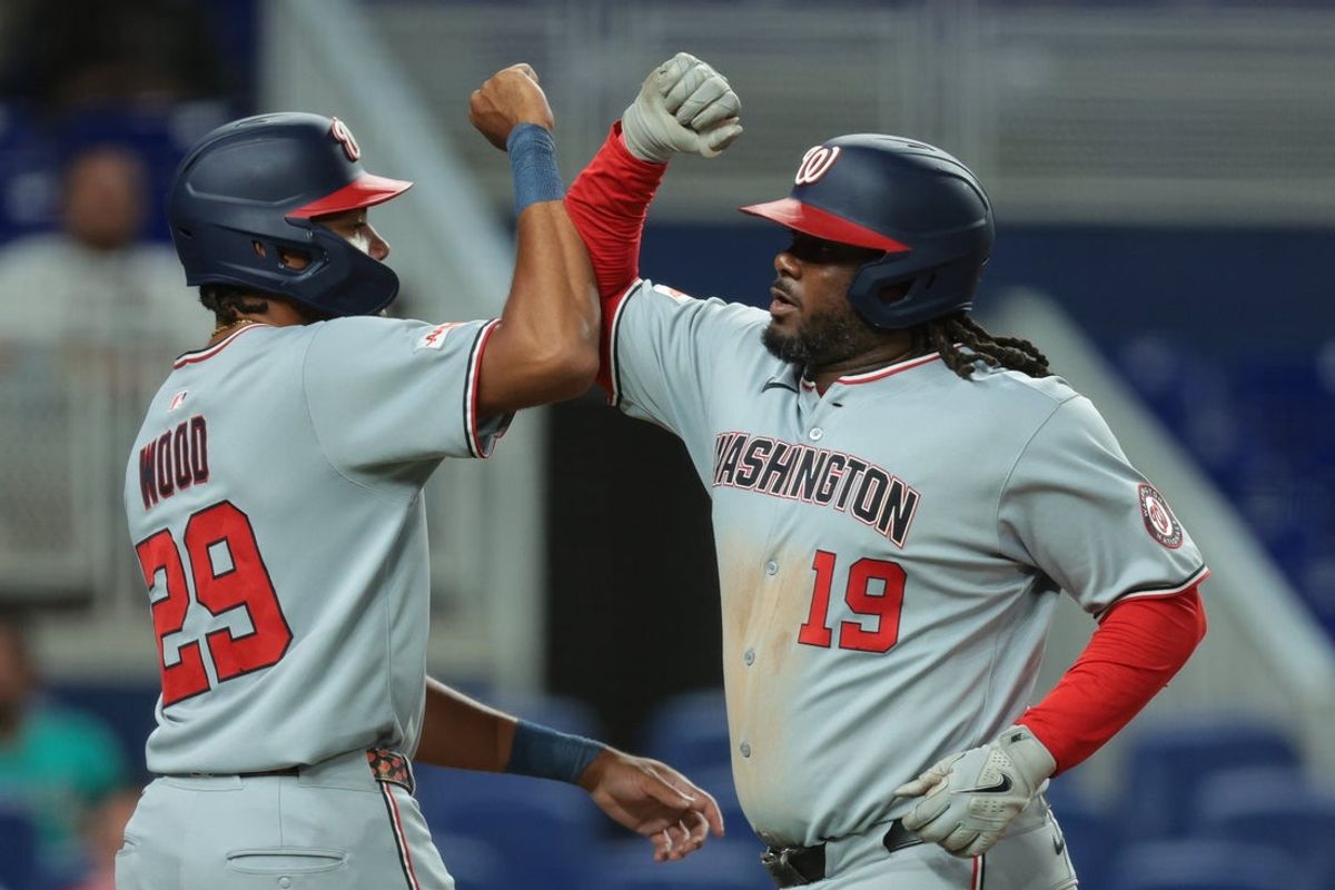 Sep 8, 2025; Miami, Florida, USA; Washington Nationals first baseman Josh Bell (19) celebrates with left fielder James Wood (29) after hitting a two-run home run against the Miami Marlins during the sixth inning at loanDepot Park. Mandatory Credit: Sam Navarro-Imagn Images