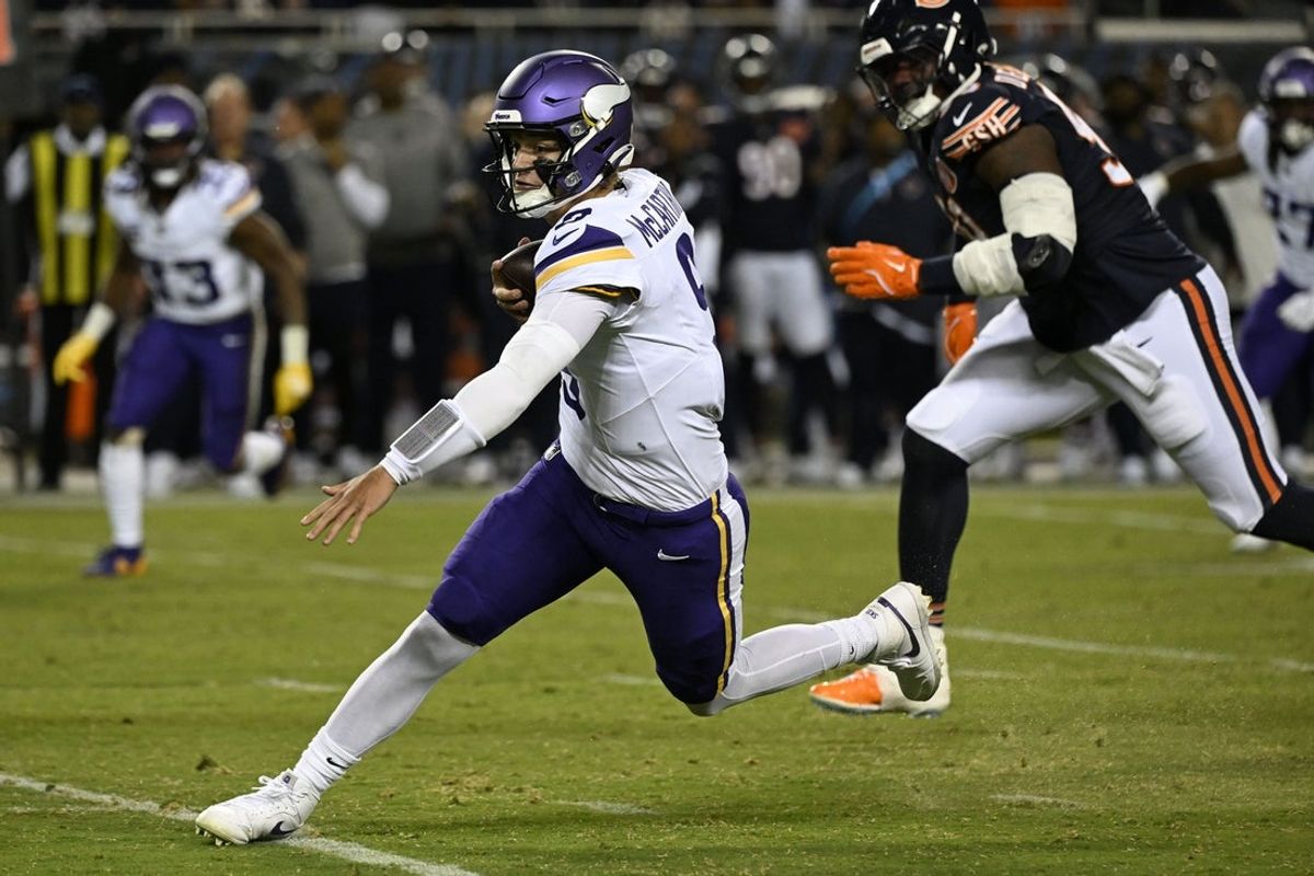 Sep 8, 2025; Chicago, Illinois, USA; Minnesota Vikings quarterback J.J. McCarthy (9) rushes the ball against the Chicago Bears during the first half at Soldier Field. Mandatory Credit: Matt Marton-Imagn Images