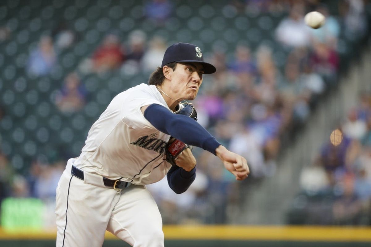 Sep 8, 2025; Seattle, Washington, USA; Seattle Mariners starting pitcher Bryan Woo (22) throws against the St. Louis Cardinals during the second inning at T-Mobile Park. Mandatory Credit: Joe Nicholson-Imagn Images