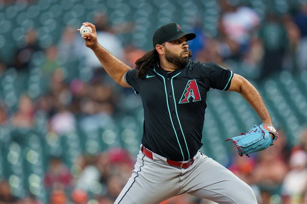 Sep 8, 2025; San Francisco, California, USA; Arizona Diamondbacks starting pitcher Nabil Crismatt (61) delivers a pitch against the San Francisco Giants during the first inning at Oracle Park. Mandatory Credit: Neville E. Guard-Imagn Images