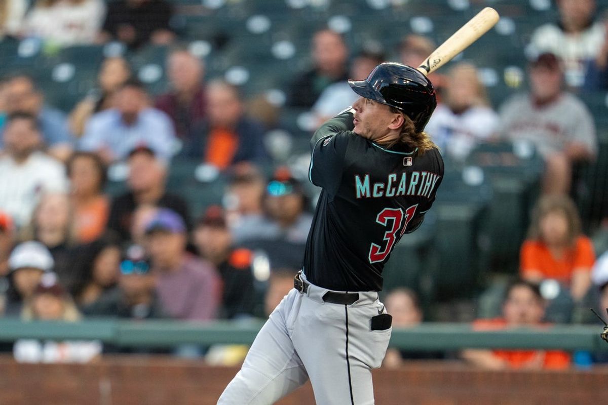 Sep 8, 2025; San Francisco, California, USA; Arizona Diamondbacks left fielder Jake McCarthy (31) hits a three run triple  against the San Francisco Giants during the second inningat Oracle Park. Mandatory Credit: Neville E. Guard-Imagn Images