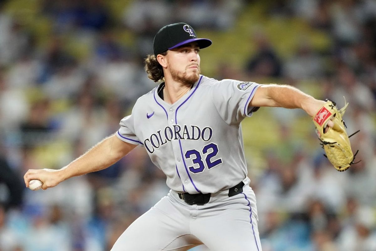 Sep 8, 2025; Los Angeles, California, USA; Colorado Rockies pitcher Chase Dollander (32) pitches in the second inning against the Los Angeles Dodgers at Dodger Stadium. Mandatory Credit: Kirby Lee-Imagn Images