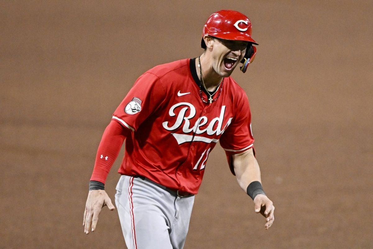 Sep 8, 2025; San Diego, California, USA; Cincinnati Reds left fielder Austin Hays (12) celebrates after hitting a solo home run during the sixth inning against the San Diego Padres at Petco Park. Mandatory Credit: Denis Poroy-Imagn Images