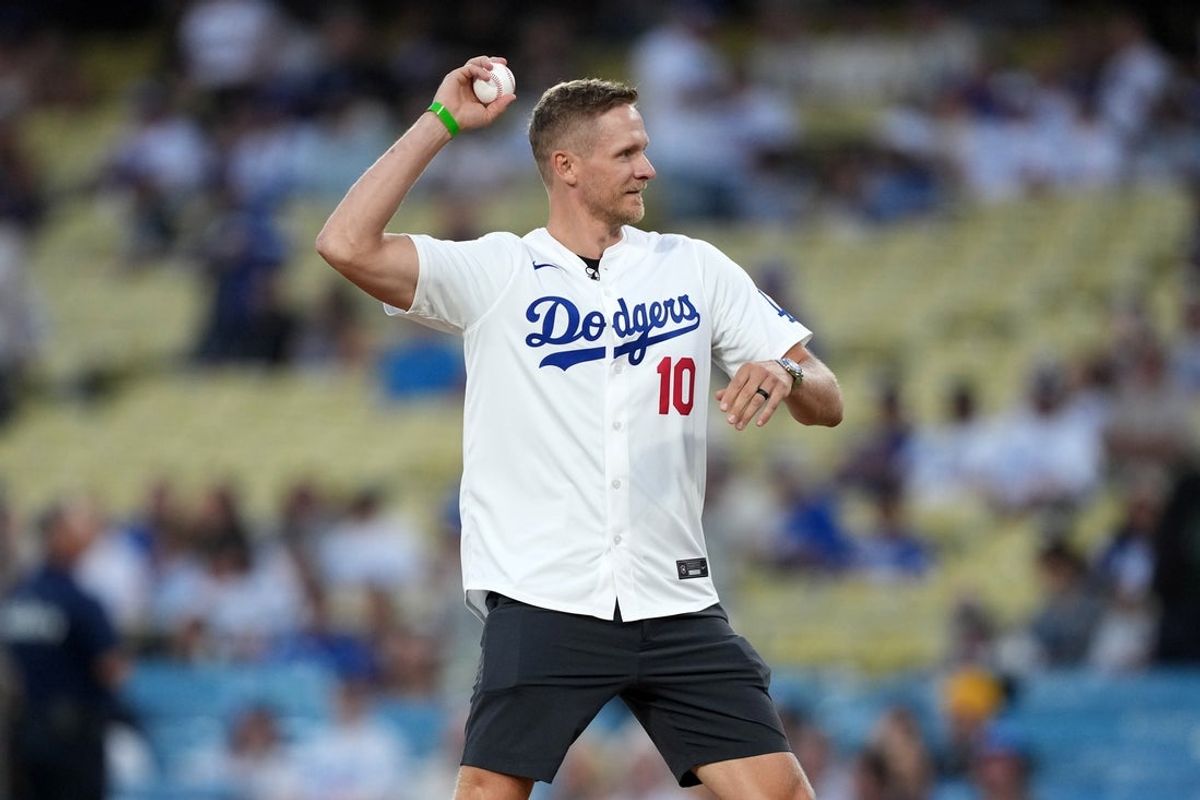 Sep 8, 2025; Los Angeles, California, USA; LA Kings forward Corey Perry throws the ceremonial first pitch before the game between the Los Angeles Dodgers and the Colorado Rockies at Dodger Stadium. Mandatory Credit: Kirby Lee-Imagn Images
